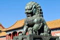 Bronze lions on the background of the buildings of the imperial palace. The Imperial Palace in Beijing Royalty Free Stock Photo